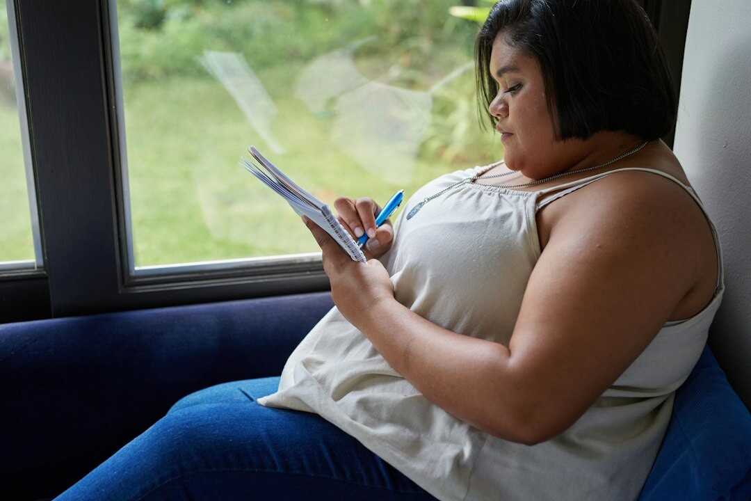 Woman reviewing notes at her desk in an office